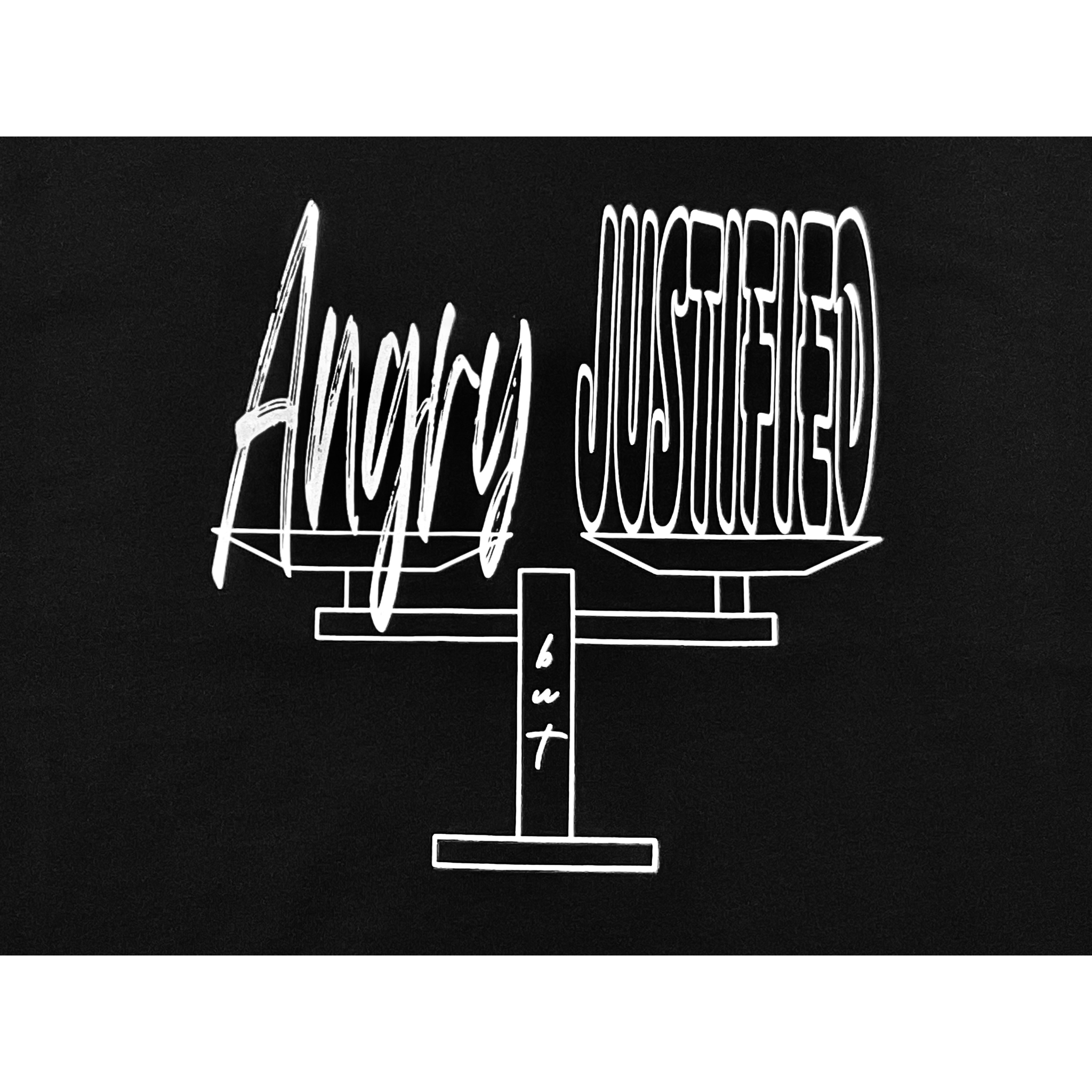 Center of black t-shirt with white graphic design of a balance scale with "Angry but Justified" white text design on a white background