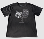 The front of a black t-shirt with white 'Angry but Justified' graphic design on a gray background.