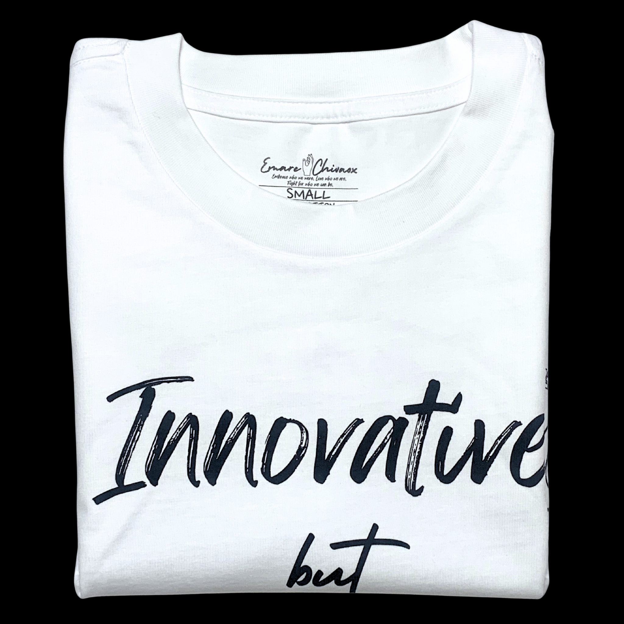 Front of white t-shirt folded with "Innovative but" black text design on a black background