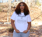 Woman wearing a white t-shirt with black 'Innovative but Appropriated' graphic design, standing outside in a field with trees.